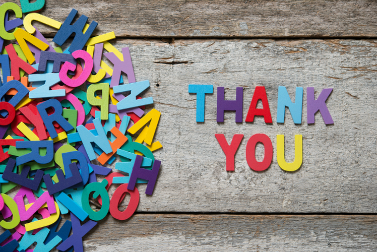 Colorful letters spelling "Thank You" on wood